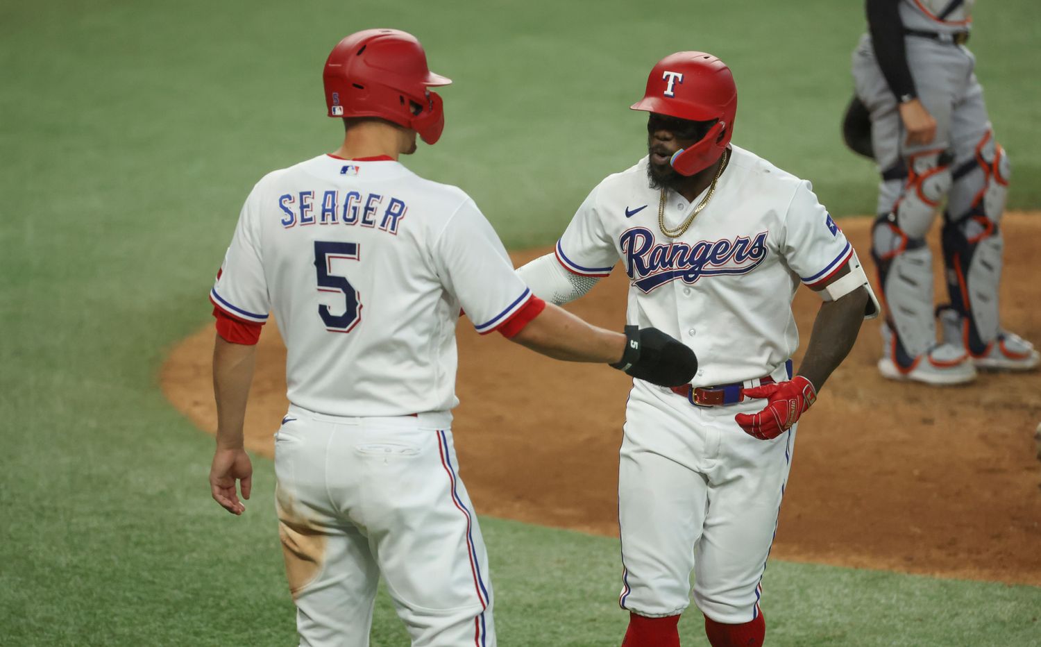 Jun 28, 2023; Arlington, Texas, USA; Texas Rangers right fielder Adolis Garcia (53) celebrates with Texas Rangers shortstop Corey Seager (5) after hitting a two-run home run during the sixth inning against the Detroit Tigers at Globe Life Field. Mandatory Credit: Kevin Jairaj-USA TODAY Sports